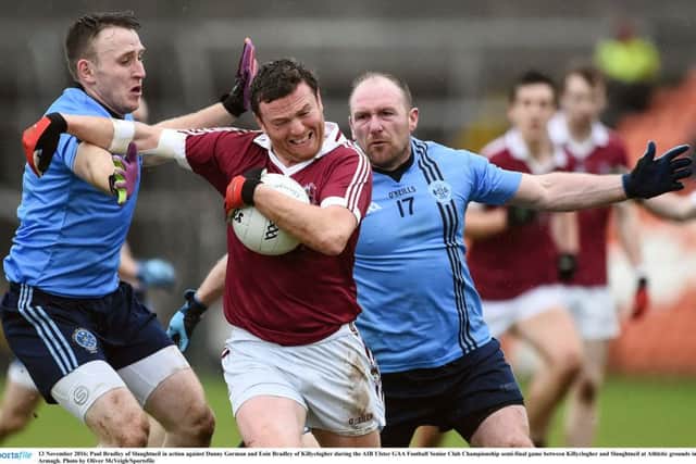 Slaughtneil's Paul Bradley, who hit four first half frees, against Danny Gorman and Eoin Bradley of Killyclogher during the AIB Ulster GAA Football Senior Club Championship semi-final. (Photo by Oliver McVeigh/Sportsfile)
