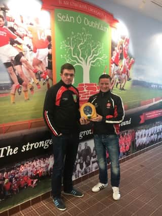Councillor Colly Kelly with Sean Dolans GAC member Eamonn McGinley with the new defibrillator.