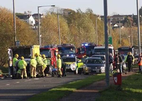 Northern Ireland Ambulance Service and Northern Ireland Fire and Rescue Service at the scene of the three vehicle collision in Derry. Photo: Simon Wells