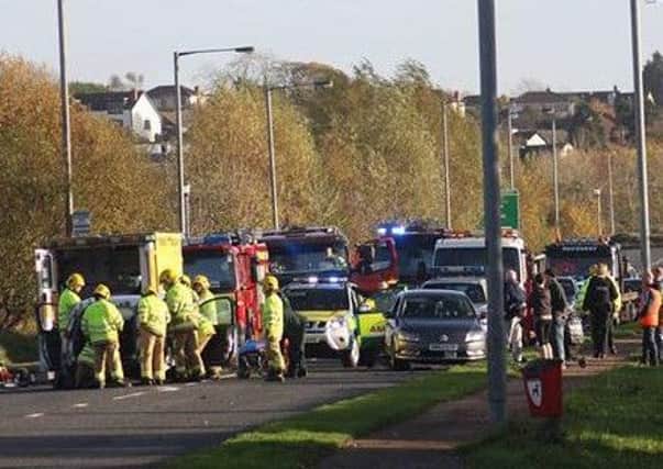 Northern Ireland Ambulance Service and Northern Ireland Fire and Rescue Service at the scene of the four vehicle collision in Derry. Photo: Simon Wells