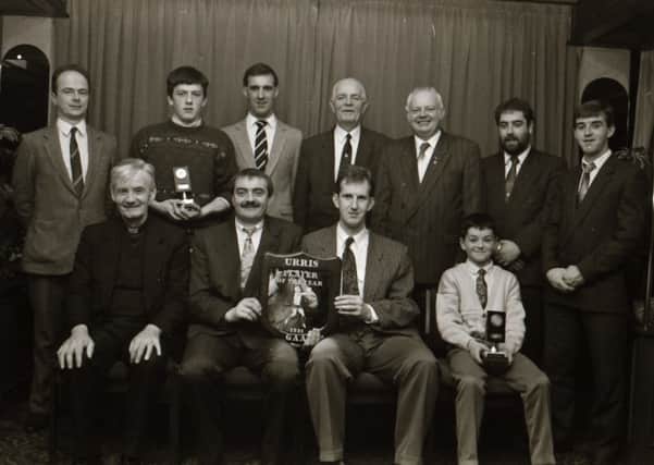 Mr Danny Friel, Chairman Urris GAA Club, seated second from left, presenting the Player of the Year award to Michael Farren. Included, at front, are, Fr. Joseph Morris, PP Clonmany, and Paul Friel, U-12 Player of the Year. Back, from left, are Neil Reid, Clubman, Joe McCarron, U-16 Player, John Canny, who received the Young Player of the Year on behalf of CJ Doherty, Matthew Kemmy, John Joe Cleary, Brendan Callaghan and Neil McLaughlin, sponsors.