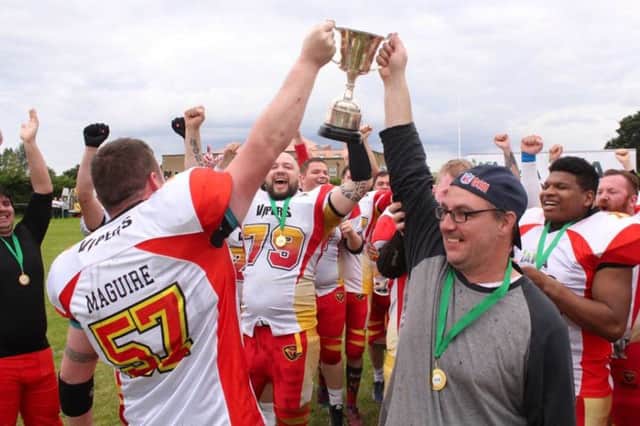 Donegal Derry Vipers coach, Jason Brock and Paddy Maguire celebrate winning the IAFL2 Bowl Trophy.
