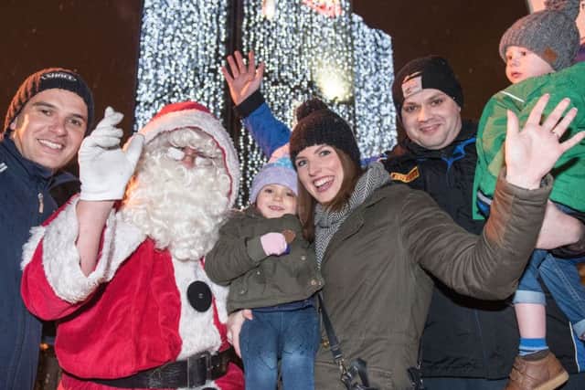 Santa pictured with Shane, Connie and Megan McGrinder and Davy, Sam and Alisin Graham after he switched the Christmas Lights on in Derry. Picture Martin McKeown. Inpresspics.com. 17.11.16