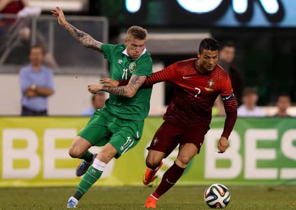 Derry's James McClean (left) goes toe-to-toe with Portugal and Real Madrid star, Cristiano Ronaldo.