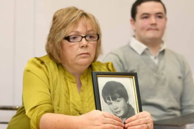 Helen Deery, the sister of Manus Deery with her son Sean at a press conference in Derry. Picture: Margaret McLaughlin