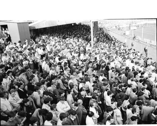 A section of the huge crowd which attended Derry Citys first game in the League of Ireland against  Home Farm in 1985.