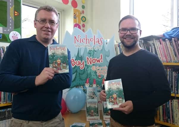 Colin Deeny and Martin Beckett, pictured with the book.