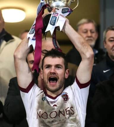 Slaughtneil captain Francis McEldowney holds aloft the Seamus McFerran cup after the AIB Ulster GAA Football Senior Club Championship Final game between Slaughtneil and Kilcoo at the Athletic Grounds in Armagh. (Photo by Oliver McVeigh/Sportsfile)