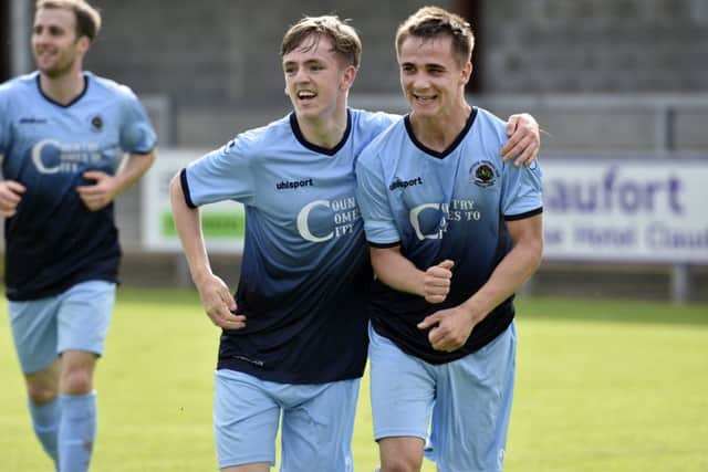 Striker Gareth Brown (right) fired Institute in front against Ballyclare Comrades.