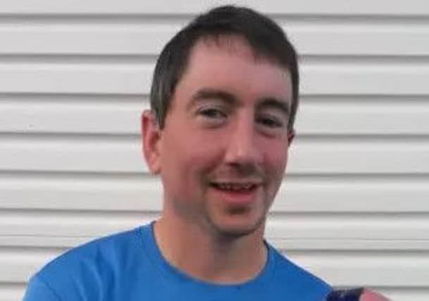 Ryan McCaul photographed by the Derry Journal outside his home after he'd completed the New York marathon in 2014 for charity.
