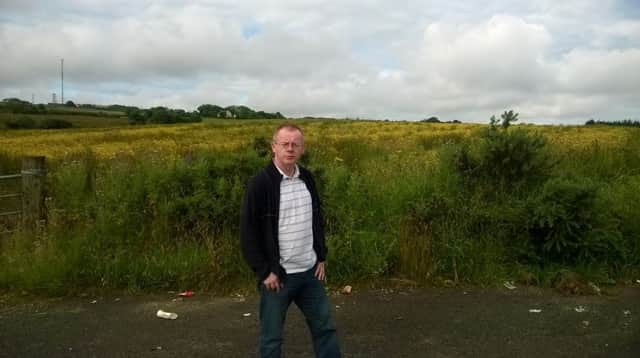 Councillor Eric McGinley at the site of the new houses