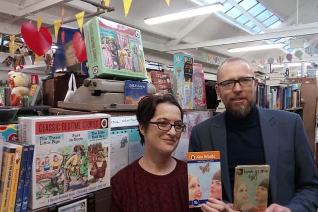 Gareth Blackery, Vice Principal at St Paul's Primary School, Galliagh and Jenni Doherty, proprietor Little Acorns Bookstore at the Yellow Yard off Bishop Street Within, pictured with two Ladybird books published 50 years apart and featuring Peter and Jane.