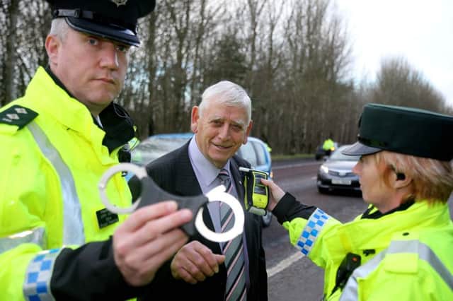 William King, Chairperson of Causeway Coast and Glens Policing and Community Safety Partnership with PSNI officers as they launch the winter drink drive campaign. Pic: Kevin McAuley