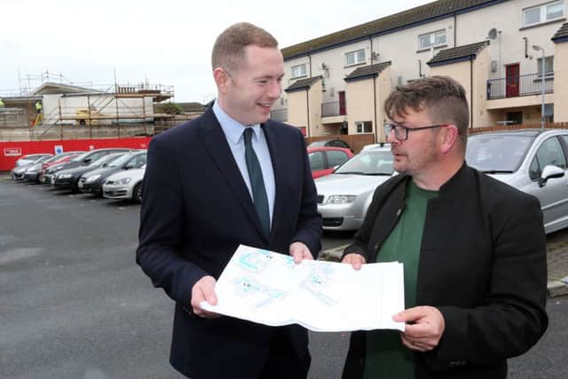 Infrastructure Minister Chris Hazzard speaking to Colm Barton, Bogside & Brandywell Initiative in July during a visit to the Bogside, Derry, to announce details of the new Residents' Parking Scheme. (Photo Lorcan Doherty Photography)