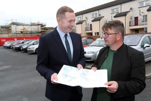 Infrastructure Minister Chris Hazzard speaking to Colm Barton, Bogside & Brandywell Initiative in July during a visit to the Bogside, Derry, to announce details of the new Residents' Parking Scheme. (Photo Lorcan Doherty Photography)