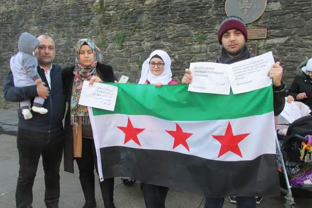 Syrian refugee families stage a protest in Derry city centre over events in their homeland. (Picture by Frankie McMenamin)