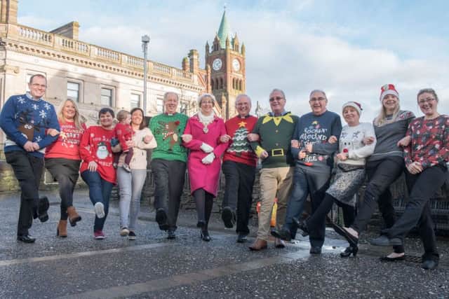 The Mayor Alderman HIlary McClintock pictured with Bishop Ken Good and Bishop Donal McKeown and charity representatives at the launch of  Christmas Jumpers Guinness the World Record Attempt in Derry-Londonderry which is taking place on Sunday the 18th of December at 11.30am. Vaious charities will benefit from the event including, Children in Crossfire, Concern, Muscular Dystropy, #Team#Evan, Foyle Hospice and  the Mayor's, Action Cancer NI and Tearfund. People can register on line at Foyle Hospice.com. Included from left are, Ciaran McGinley, Foyle Hospice, Caroline Gibbons and Kay Killen, Action Cancer, Louise James and baby RÃ¬oghnach, Muscular Dystropy #Team#Evan, Bishop Ken Good, the Mayor Alderman Hilary McClintock, Action Cancer and Tewar Fund,  Bishop Donal McKeown, Richard Moore, Children in Crossfire, Alan Rowan, Tear Fund, Cora Morrison, Concern, Sarah Egan, Concern and Pauline Daniels, Muscular Dystropy, #Team#Evan.  Picture Martin McKeown. Inpresspics.com. 09.11.16