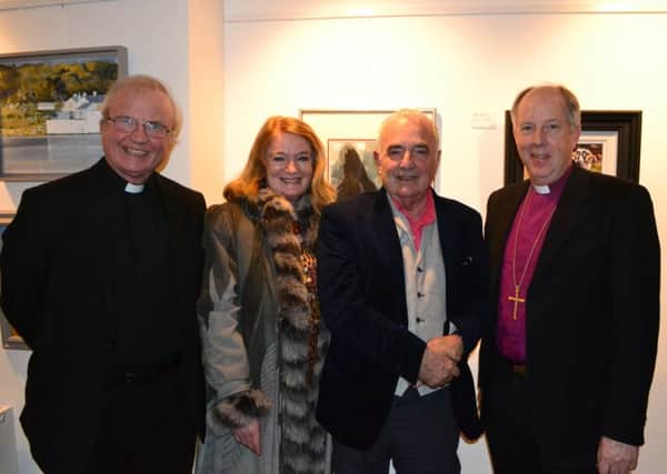 Denise and Brian Ferran (centre) with the Bishop of Derry, Dr Donal McKeown and the Bishop of Derry and Raphoe, Rt Rev Ken Good, at the Border Counties Connected Through Art exhibition.