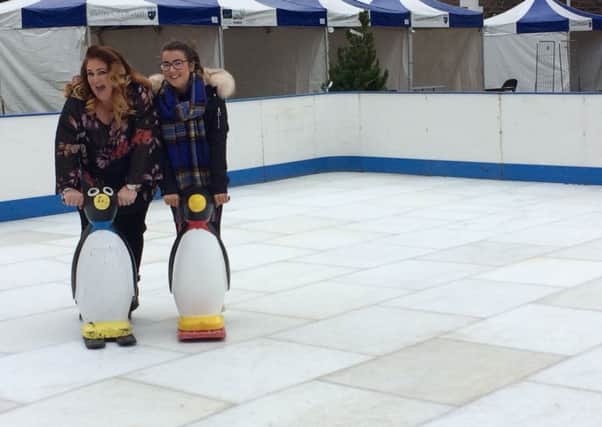 Ashleen Schenning and Sara McCloskey from LCDI try out the new ice rink.