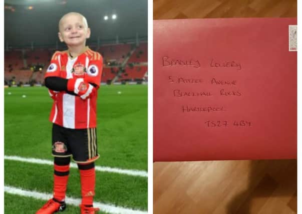 Five year-old Bradley Lowery and a Christmas card that was sent from Derry to his address in England on Friday.