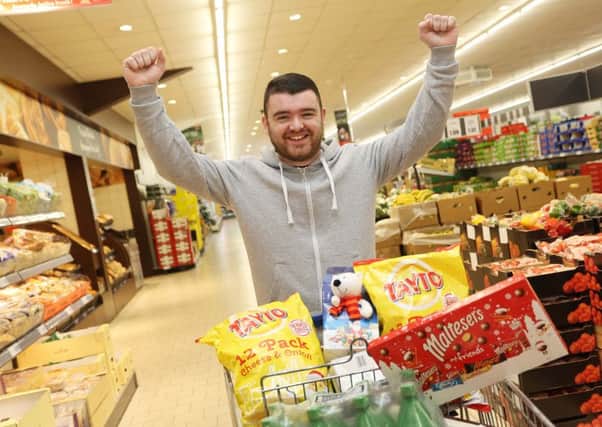 Pictured at the Lidl Northern Ireland Christmas Trolley Dash for CLIC Sargent in Lidl Derry is Darren Morrin, from Creggan, Derry, who managed to grab Â£190 worth of goodies dashing around the store for 2 minutes.