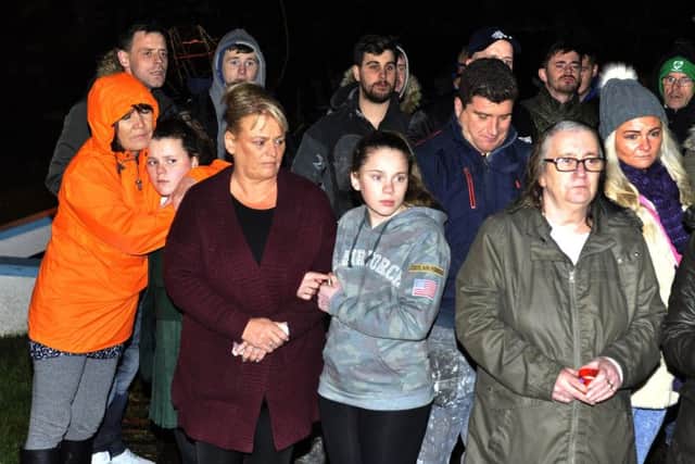 Relatives of children and young people from the area who passed away pray in silence at the Brandywell Grotto during a candlelight tree planting ceremony in their memory. DER5116GS019
