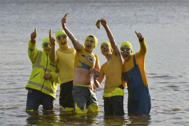 The Dell boys pose for selfies with their banana mobiles at the annual Village Association New Years Day dip at Redcastle, DER0117GS010