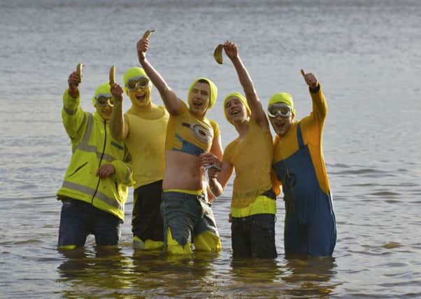 The Dell boys pose for selfies with their banana mobiles at the annual Village Association New Years Day dip at Redcastle, DER0117GS010