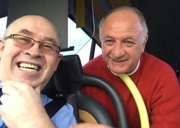 Derry bus driver Jonathan Leckey with World Cup winning ex-Brazil coach Luiz Felipe 'Big Phil' Scolari, who was spotted doing the rounds in the city recently.