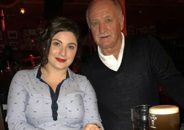 World Cup winning coach and former Chelsea F.C. boss, 'Big Phil' Scolari called into the Belfast Empire to enjoy some live music and sample the Guinness on Thursday evening. Included in the photo is the Belfast Empire manager, Zhana. (Photo: Courtesy of the Belfast Empire)