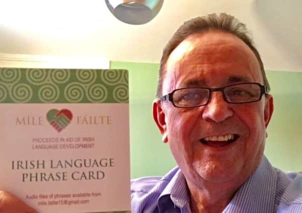 Dominic Bradley with his Irish language phrase card.