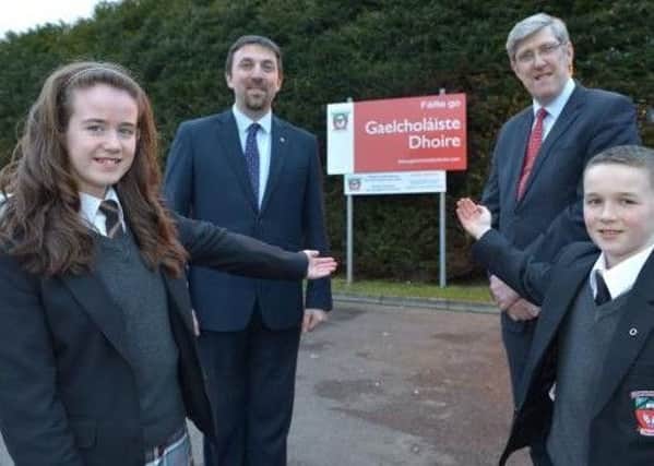 Former Education Minister, John O'Dowd, at the official opening of GaelcholÃ¡iste Dhoire, Dungiven in 2015. with Principal  Diarmaid Ua Bruadair and pupils. (file pic)