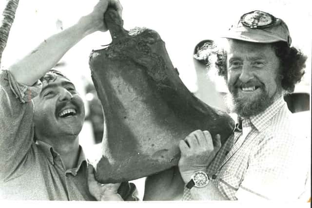 Des and Ray Cossum pictured with the Laurentic bell during a salvage operation on the Allerton in 1979.