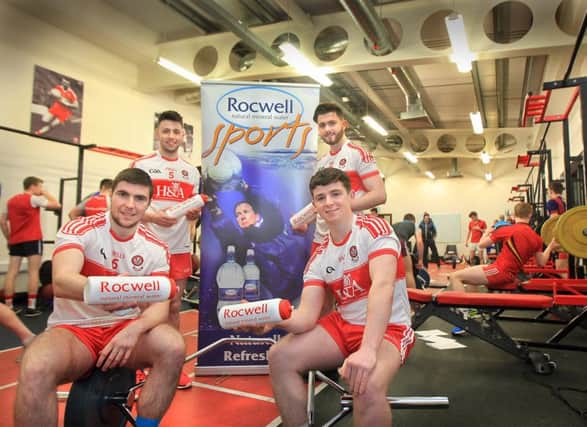 Derry senior footballers CiarÃ¡n McFaul and Peter Hagan join with Oak Leaf hurlers, Johnny O'Dwyer and Darragh Cartin, to launch the county's new hydration partnership with Rocwell Natural Mineral Water.