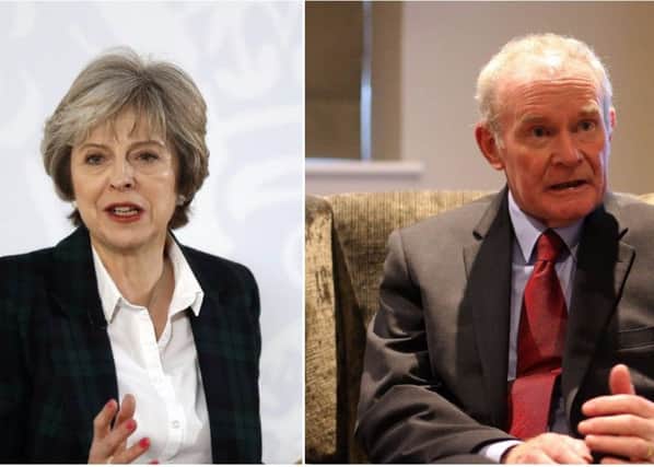 Theresa May and Martin McGuinness.