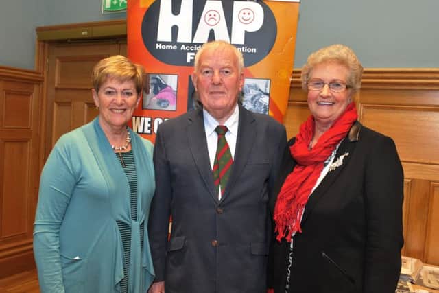 Joan Henderson, Tony Henderson and Helen Parke pictured at the recent mayoral reception in the Guildhall to commemorate the 50th Anniversary of Home Accident Prevention Foyle. DER0317GS006