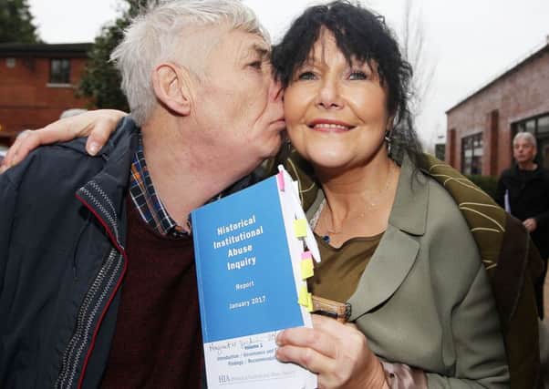 Victims campaigner Margaret McGuckin gets a kiss from her brother Kevin, who was a victim of institutional abuse, after the report and its findings were released.   Picture by Jonathan Porter/PressEye.com