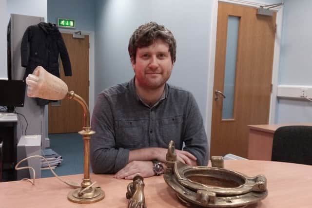 Ronan McConnell from the Tower Museum  with some of the artefacts salvaged from the Laurentic to be exhibited.