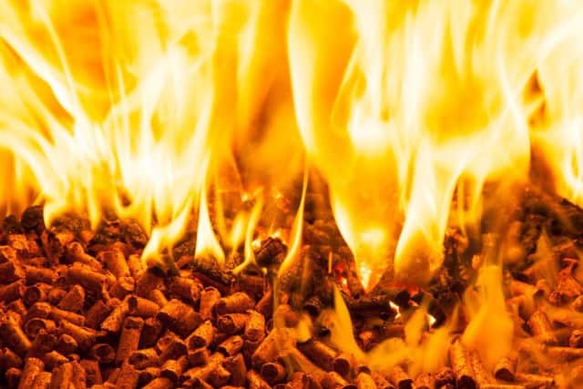 Burning wood pellets