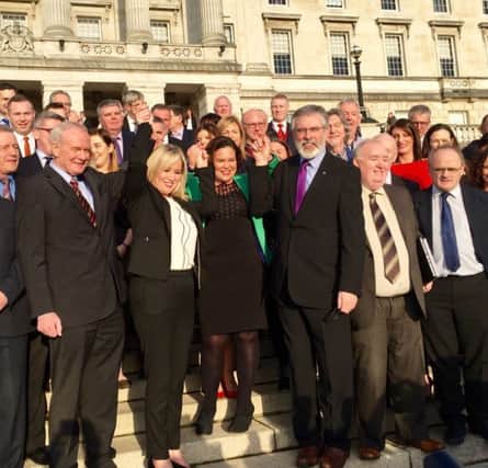 Michelle O'Neill with Martin McGuinness, Mary Lou McDonald, Gerry Adams and other elected Sinn Fein representatives at Stormont.