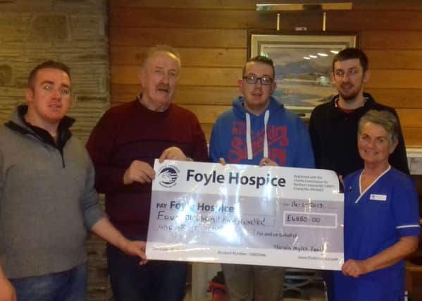 Martin Myles and sons Christopher, Stephen and Sean presenting a cheque to  Foyle Hospice staff nurse Marion ODonnell for Â£4,550, proceeds from a tea dance held in Benedy Hall, Dungiven in memory of Bernie Myles