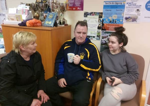 Earhart Park residents Tim McGillan and his daughter Nicole, pictured speaking with SDLP Councillor Angela Dobbins at Shantallow Community Centre.