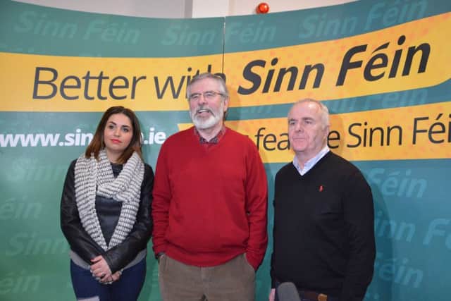 Gerry Adams pictured at the Gasyard Centre with Sinn Fein Foyle Assembly candidates Elisha McCallion and Raymond McCartney.