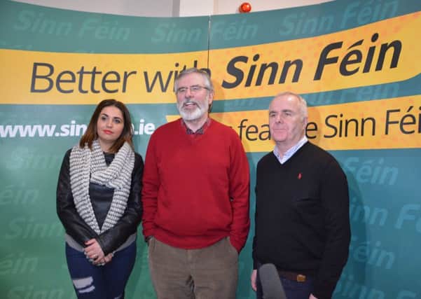 Gerry Adams pictured at the Gasyard Centre with Sinn Fein Foyle Assembly candidates Elisha McCallion and Raymond McCartney.