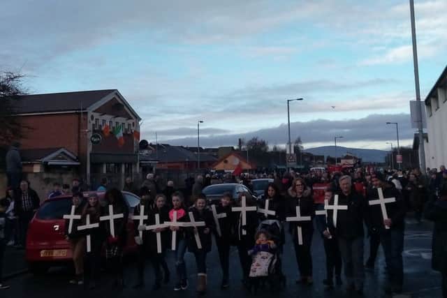 Relatives of those killed and some of the wounded carry the white crosses in memory of the dead at the annual Bloody Sunday March for Justice.
