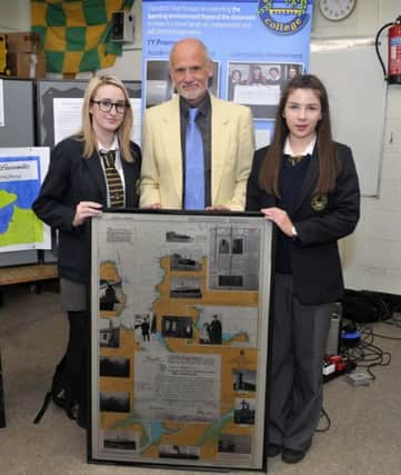 Liverpudlian  Alan Clare, whose grandfather James Robert Brown served as an Engineering Officer on the Laurentic, makes a presentation to Crana College during a recent visit. Included in the picture are students Caoimhe ODonnell and Abbie McGrath. DER0417GS014