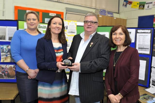 Mr Don McNeill, chairman Ulster - Canada Initiative, receives a gift in appreciation for his contribution to the Laurentic centenary commemoration from Crana College staff members Mrs Michelle Bradley, Mrs Sinead Anderson and Mrs Mary Harkin.  DER0417GS019