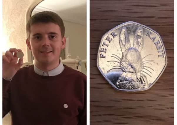 Derry man, CaolÃ¡n McGinley, pictured with the coin he found.