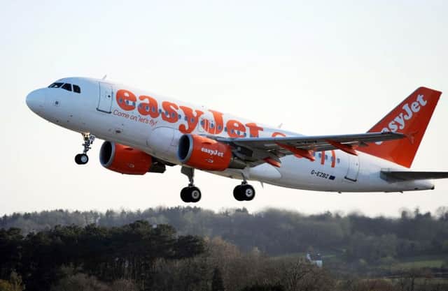 File photo dated 21/04/10 of a plane of the budget airline easyJet, as the low-fare airline climbed to a record Â£317 million today as higher sales offset a further Â£182 million surge in fuel costs. PRESS ASSOCIATION Photo. Issue date: Tuesday November 20, 2012. The group achieved the 28% rise in profits for the year to September 30 after it carried 58 million passengers - an improvement of 7% on a year earlier - and benefited from continuing cost-cutting efforts. See PA story CITY EasyJet. Photo credit should read: Barry Batchelor/PA Wire