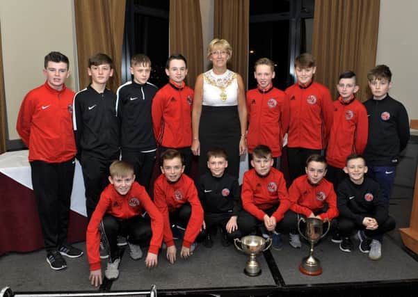 Newell Academys U-12 league and cup winners pictured with the Mayor Alderman Hilary McClintock at the recent Derry & District Youth FA Awards held in the City Hotel. DER0417GS032